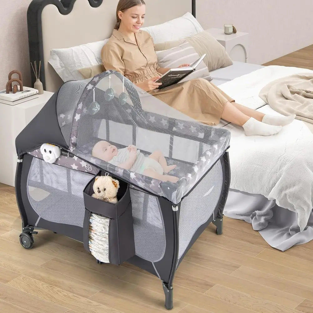 Pack and Play, 4 in 1 Portable Baby Playard with Bassinet, Changing Table, Lockable Wheels, Music Box, oldable Travel Baby Crib